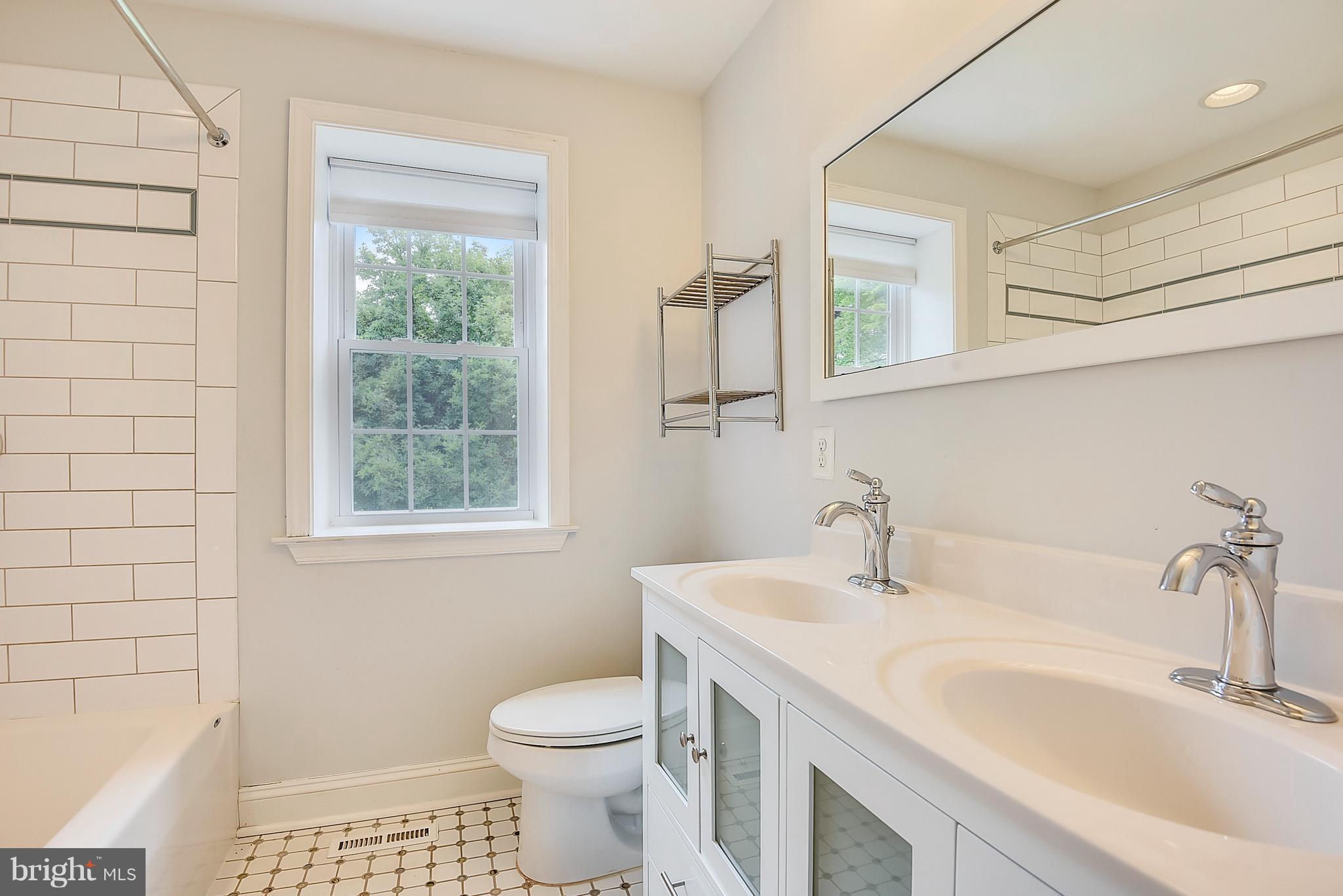 13039 Beaver Dam Road Cockeysville, MD 21030 - Photo 11 of 20 a bathroom with a sink a toilet and shower