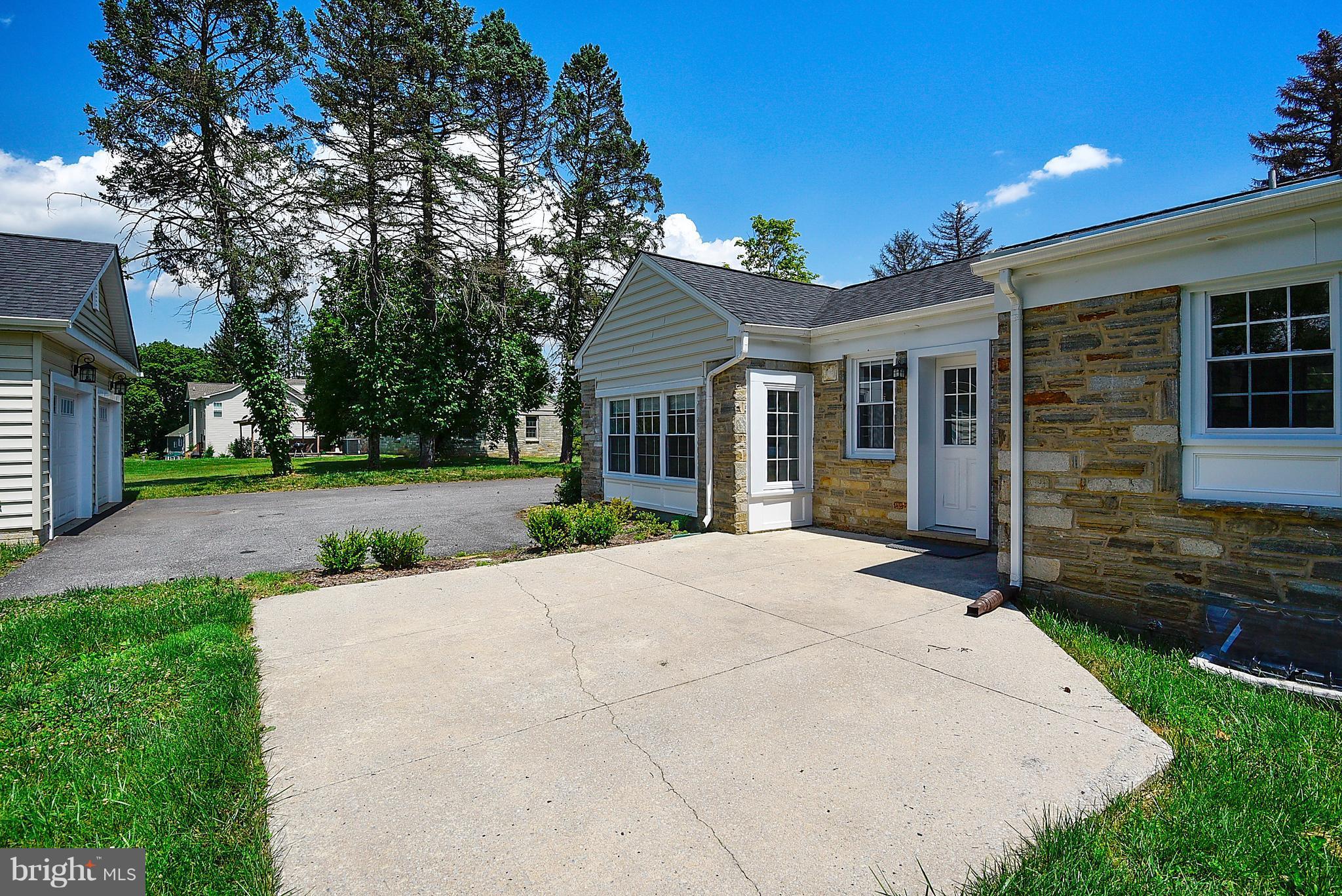 13039 Beaver Dam Road Cockeysville, MD 21030 - Photo 17 of 20 a front view of a house with yard and green space