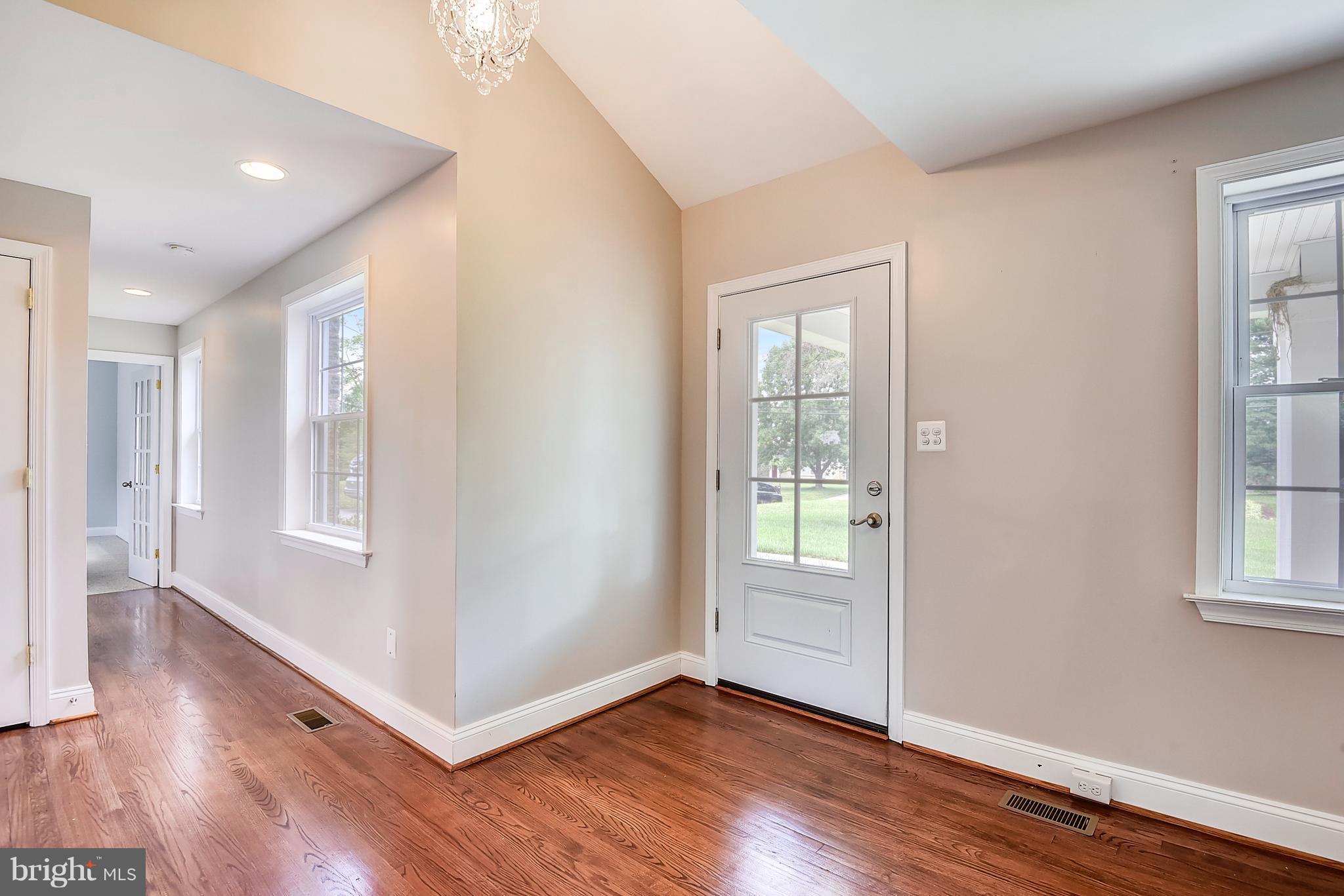 13039 Beaver Dam Road Cockeysville, MD 21030 - Photo 4 of 20 an empty room with wooden floor and windows