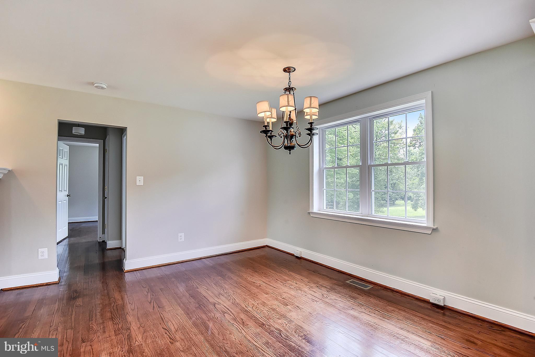 13039 Beaver Dam Road Cockeysville, MD 21030 - Photo 6 of 20 a view of an empty room with wooden floor and a window