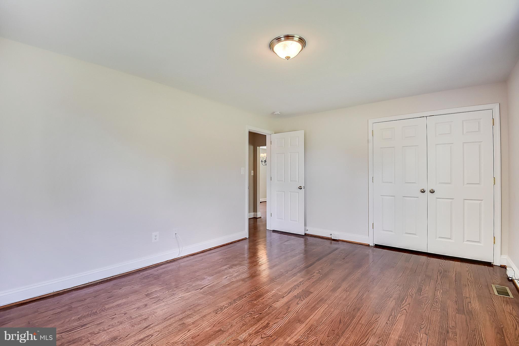 13039 Beaver Dam Road Cockeysville, MD 21030 - Photo 9 of 20 a view of an empty room and wooden floor