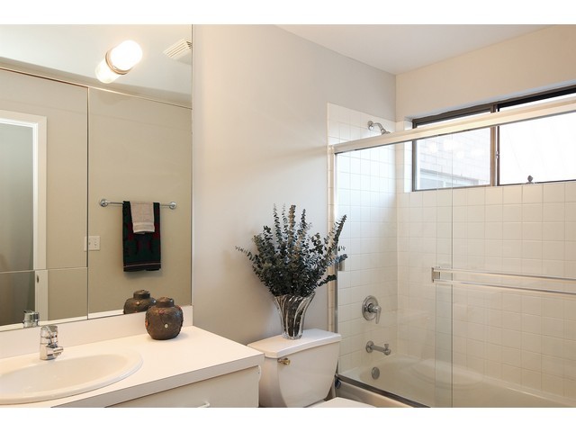 1900 South Federal Street, Unit B Chicago, IL 60616 - Photo 10 of 10 a bathroom with a double vanity sink mirror and shower