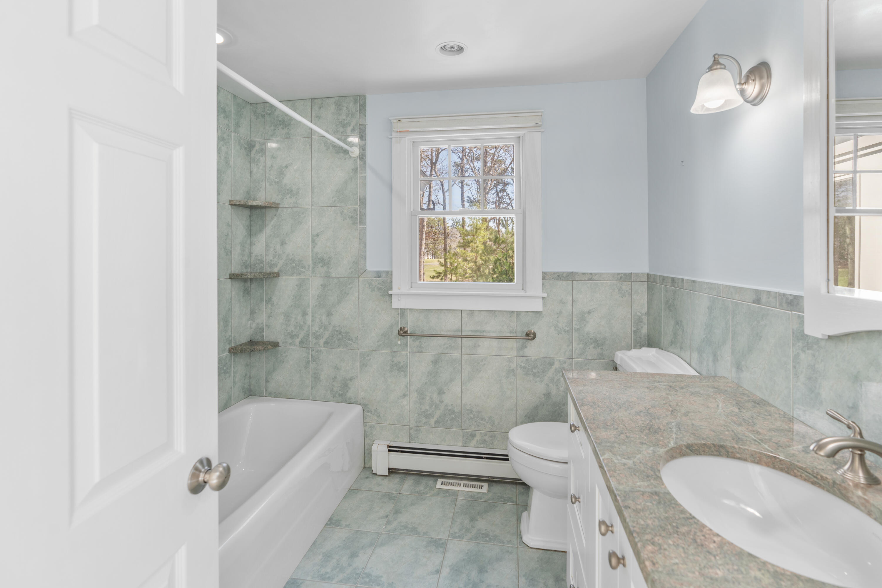 51 Walton Heath Way Mashpee, MA 02649 - Photo 15 of 35 a bathroom with a granite countertop sink toilet tub and shower