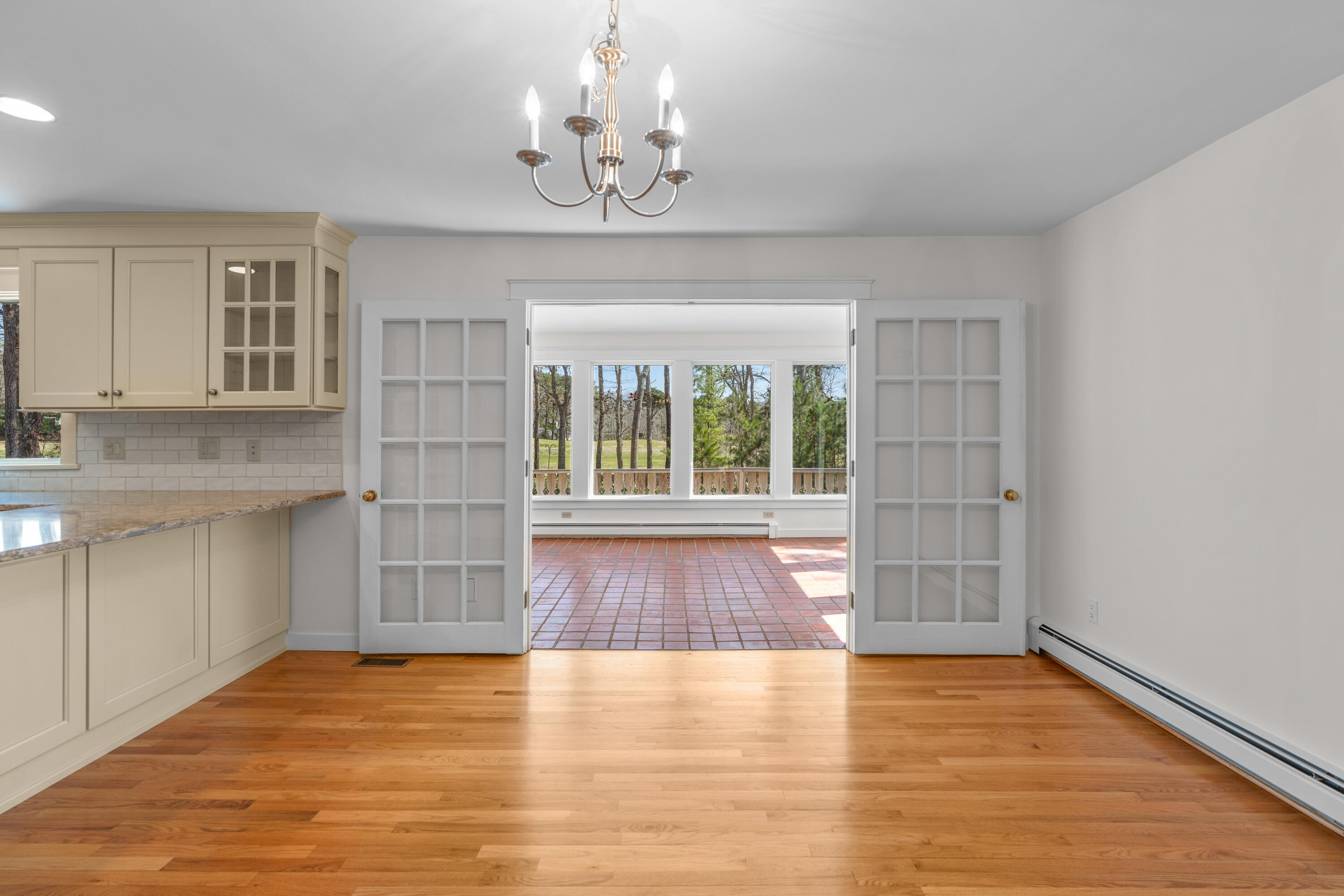 51 Walton Heath Way Mashpee, MA 02649 - Photo 6 of 35 a view of an empty room with wooden floor and a window