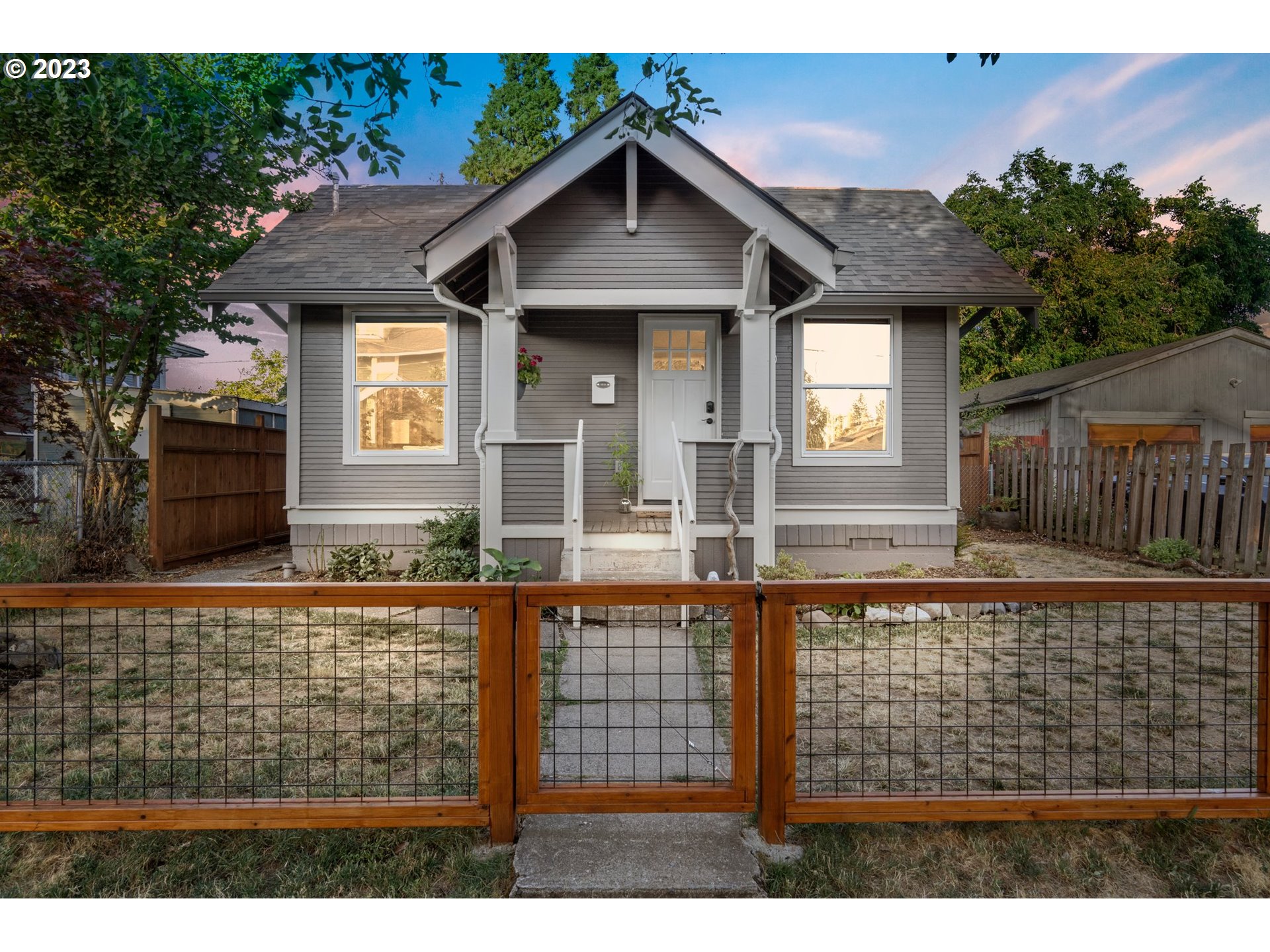 a front view of a house with garden