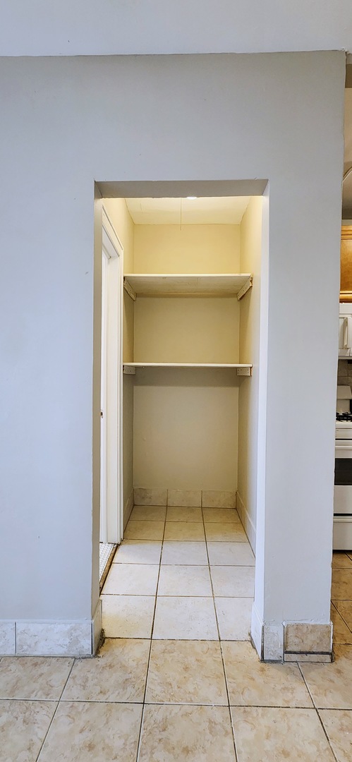 4764 North Virginia Avenue, Unit 214 Chicago, IL 60625 - Photo 11 of 12 a view of a room with a door