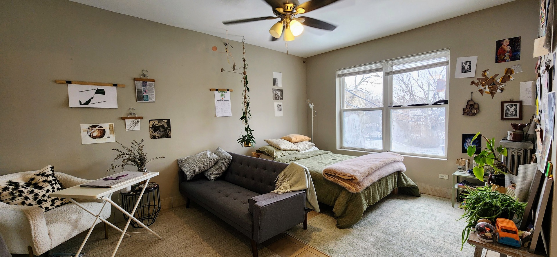 4764 North Virginia Avenue, Unit 214 Chicago, IL 60625 - Photo 8 of 12 a living room with furniture fireplace and a large window