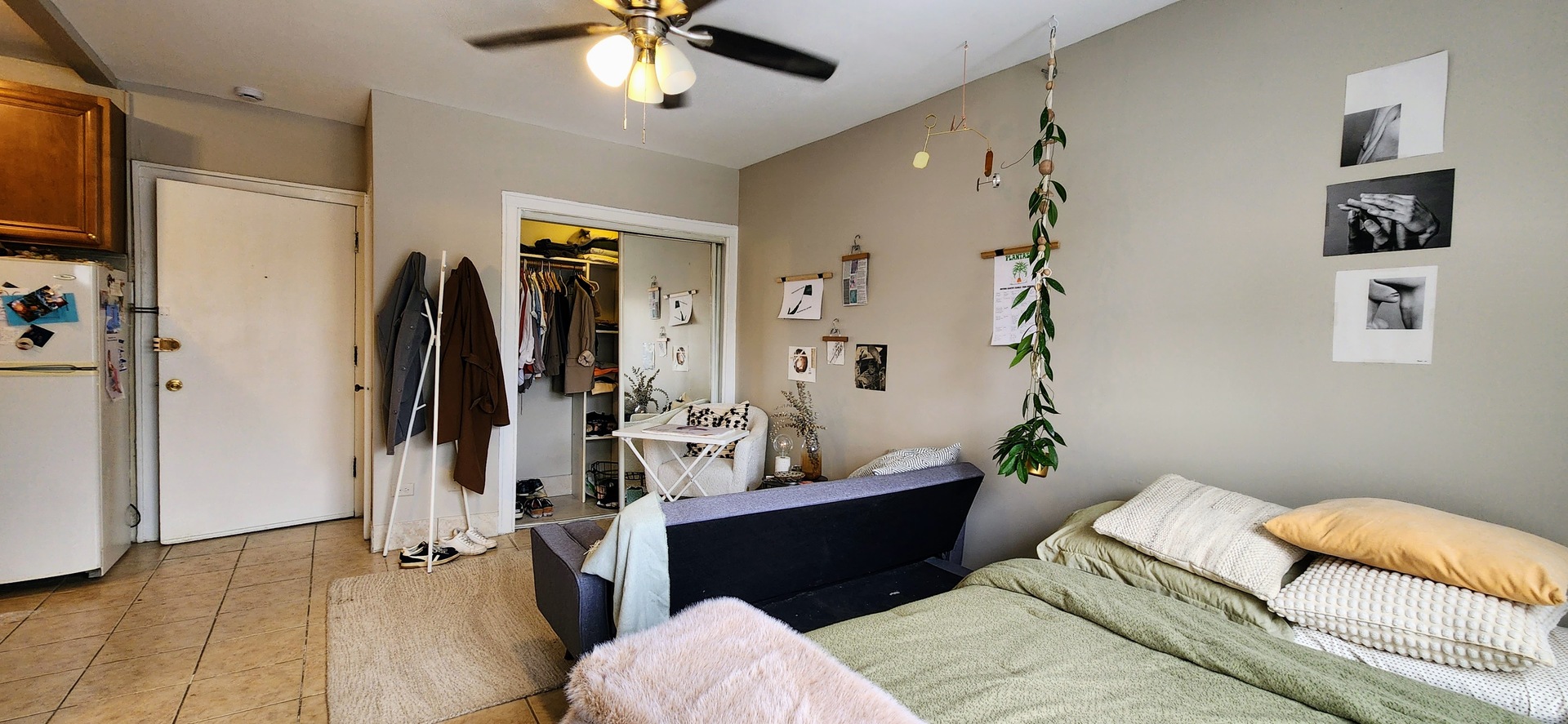 4764 North Virginia Avenue, Unit 214 Chicago, IL 60625 - Photo 10 of 12 a bed room with a bed and a couch