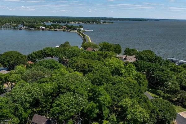 an aerial view of a houses with a lake view