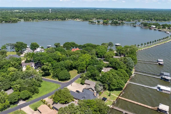 an aerial view of a houses with a lake view