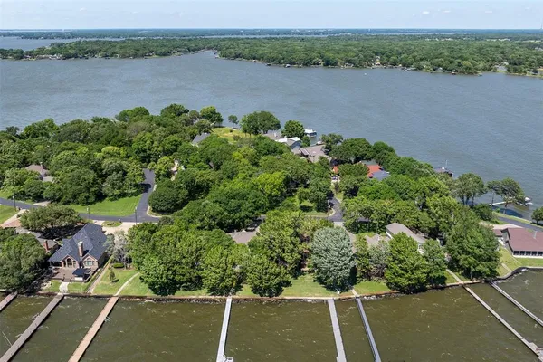an aerial view of a houses with a lake view