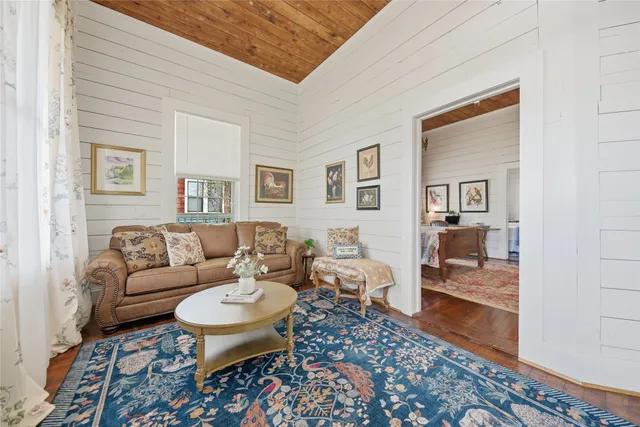 a living room with furniture and a rug