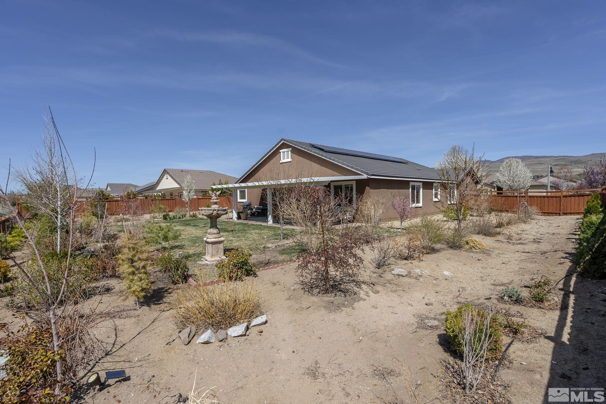 7707 Rhythm Circle Sparks, NV 89436 - Photo 23 of 25 a front view of a house with a yard