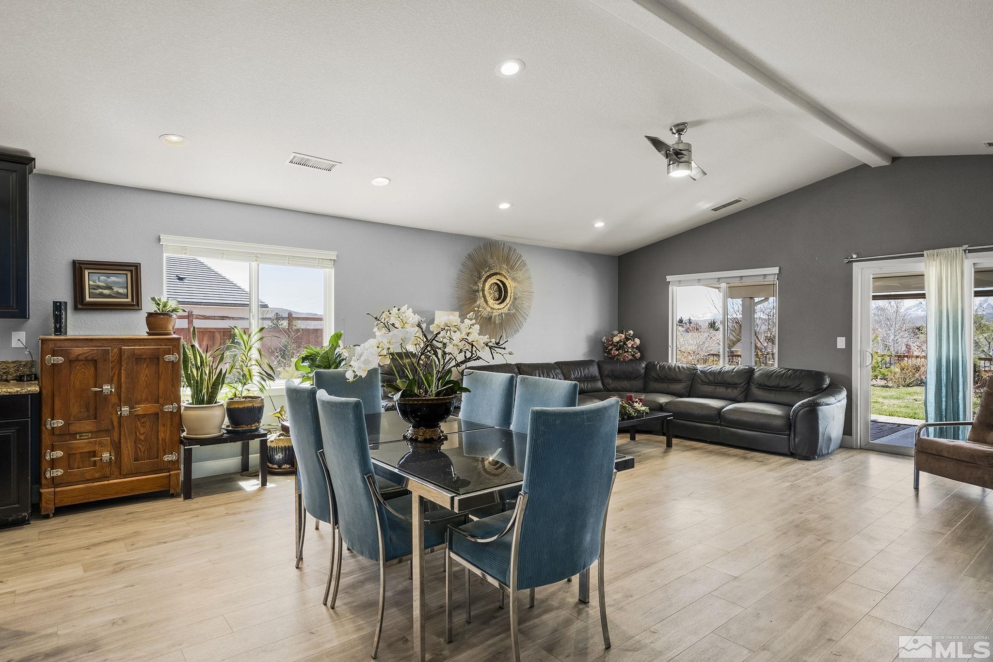 7707 Rhythm Circle Sparks, NV 89436 - Photo 4 of 25 a view of a dining room with furniture window and wooden floor