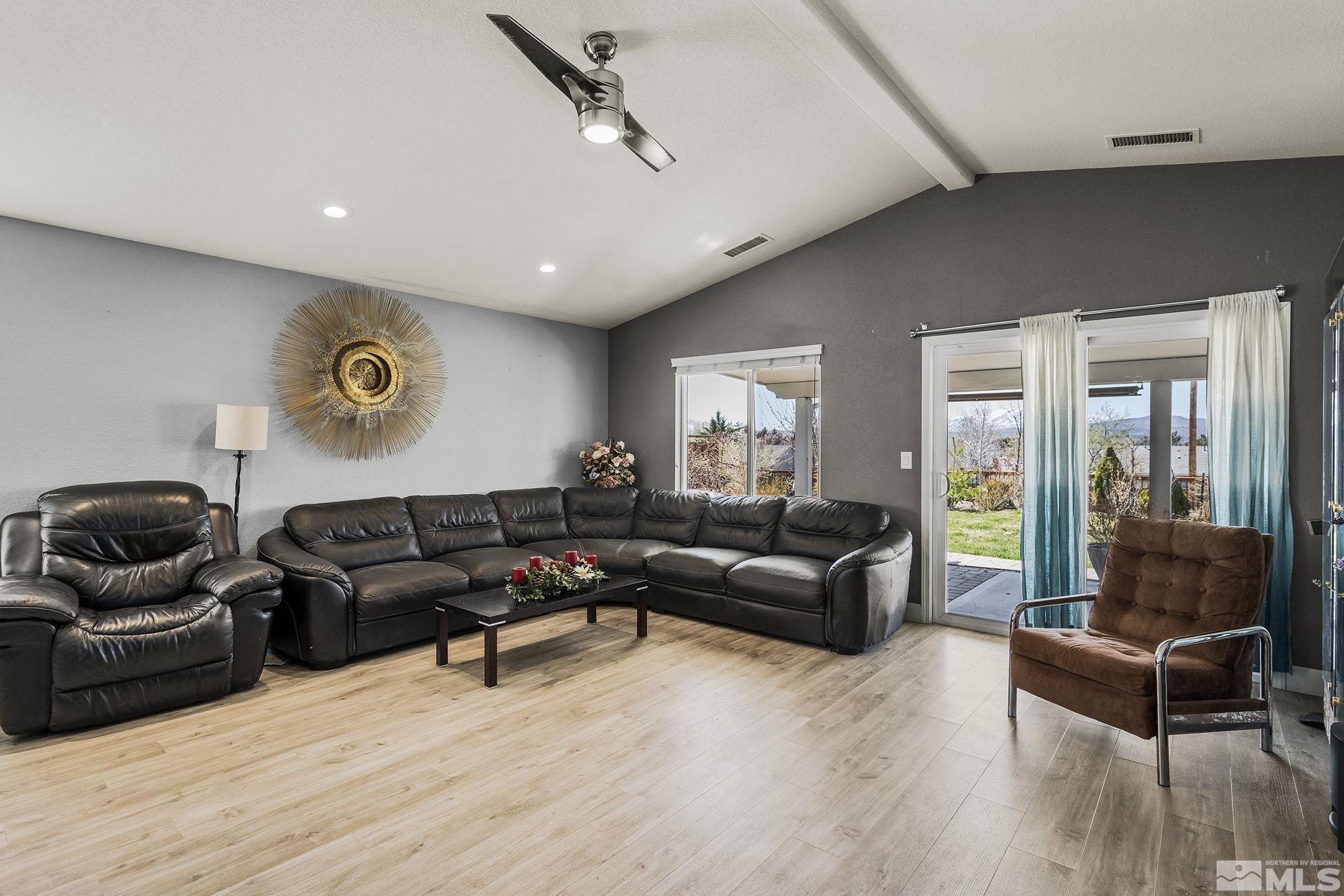 7707 Rhythm Circle Sparks, NV 89436 - Photo 6 of 25 a living room with furniture and wooden floor