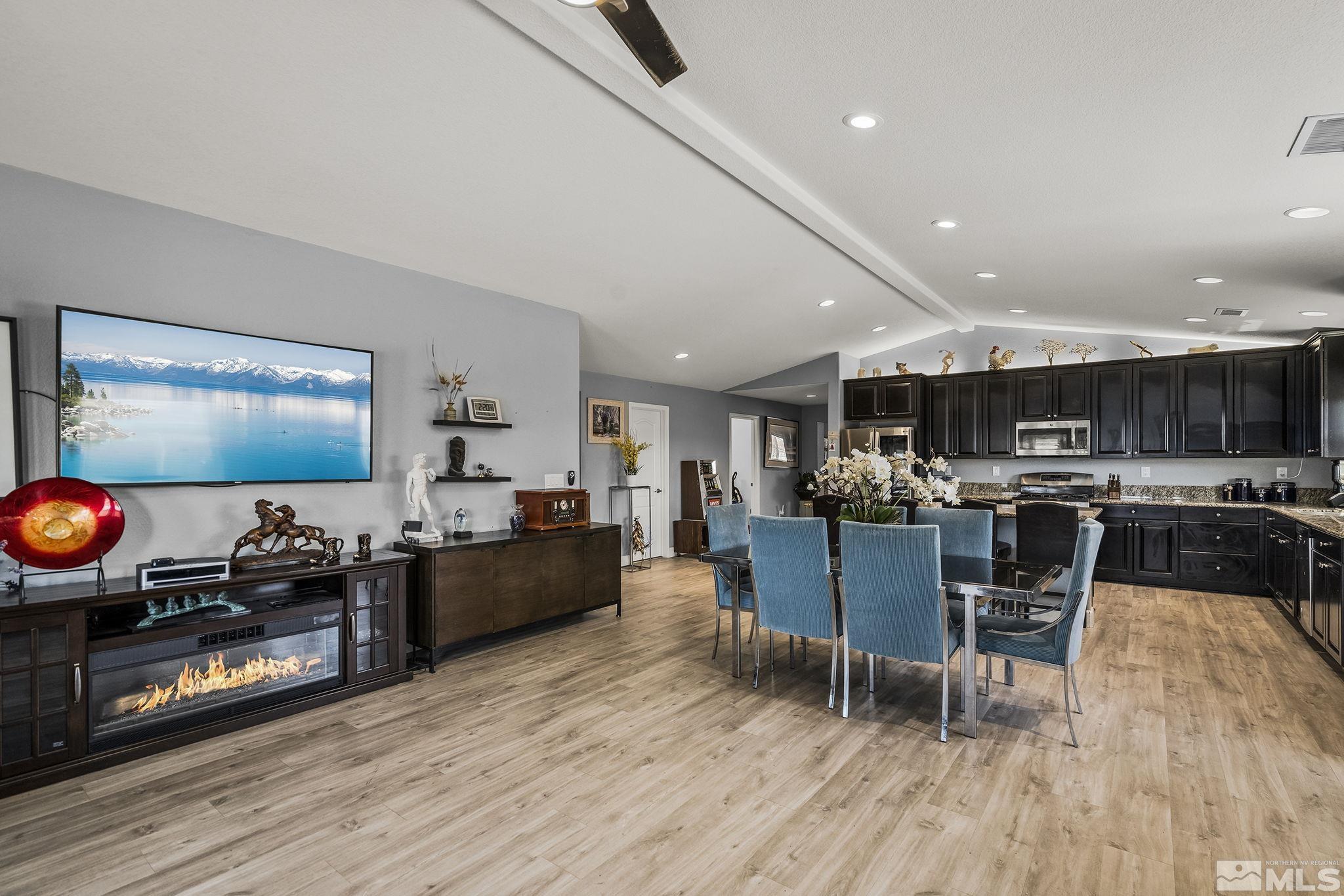 7707 Rhythm Circle Sparks, NV 89436 - Photo 8 of 25 a living room with furniture and a wooden floor