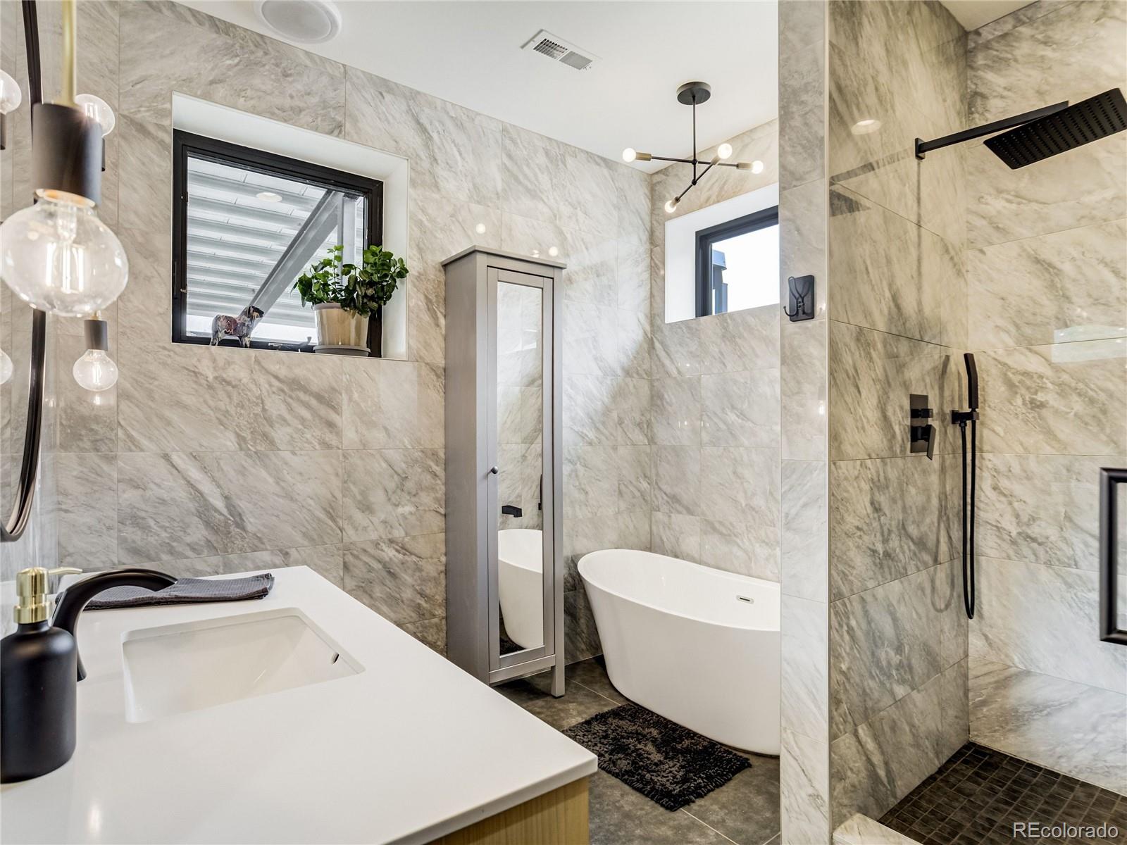 284 Crystal Park Road Manitou Springs, CO 80829 - Photo 26 of 39 a bathroom with a sink toilet and shower