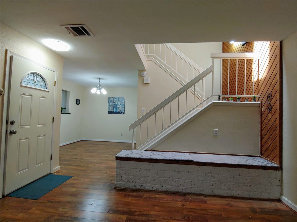 8340 Fathom Circle, Unit 401D Austin, TX 78750 - Photo 3 of 16 a view of entryway and hall with wooden floor