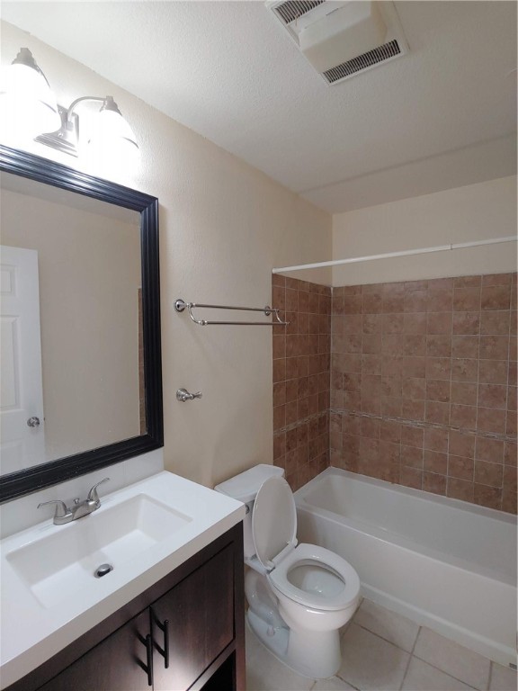 8340 Fathom Circle, Unit 401D Austin, TX 78750 - Photo 9 of 16 a bathroom with a sink a toilet and shower