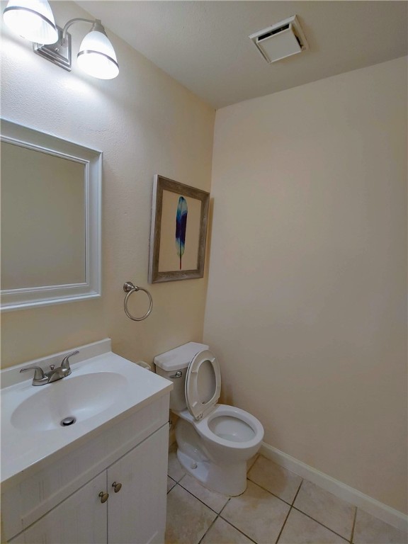 8340 Fathom Circle, Unit 401D Austin, TX 78750 - Photo 10 of 16 a bathroom with a sink a toilet and mirror