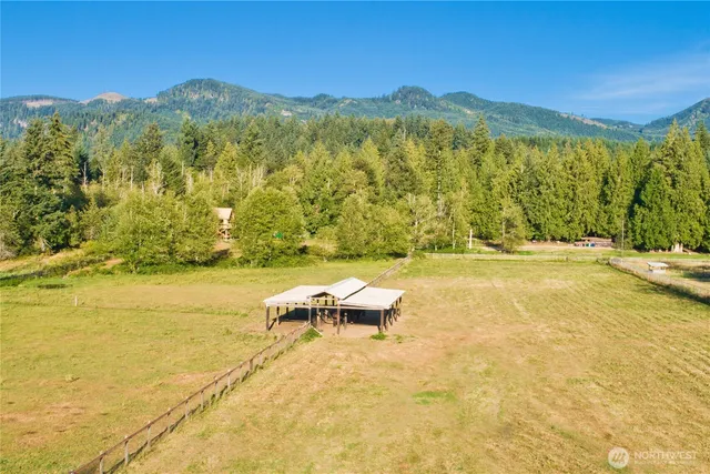 an aerial view of residential house with green space