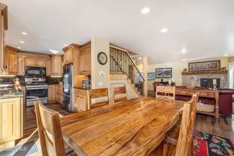 a living room with lots of furniture and wooden floors