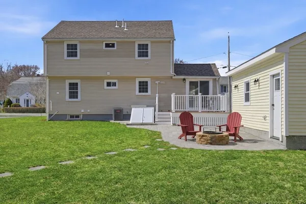 a front view of house with a garden and patio