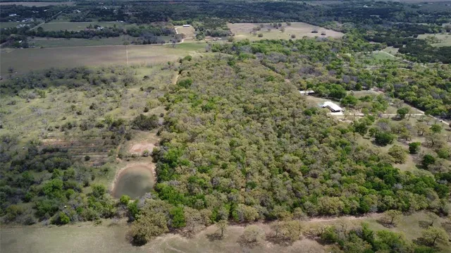 a view of a lake with lots of trees