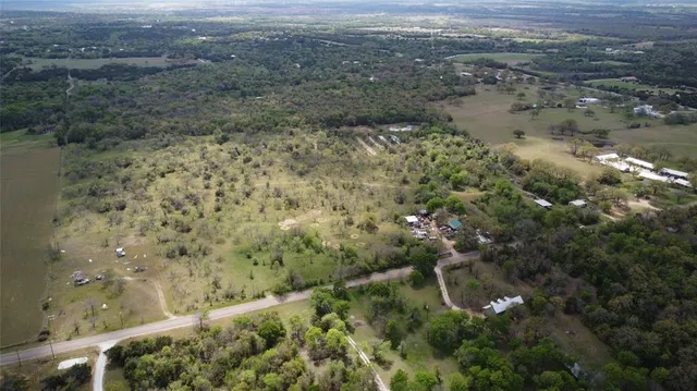 a view of a yard with trees
