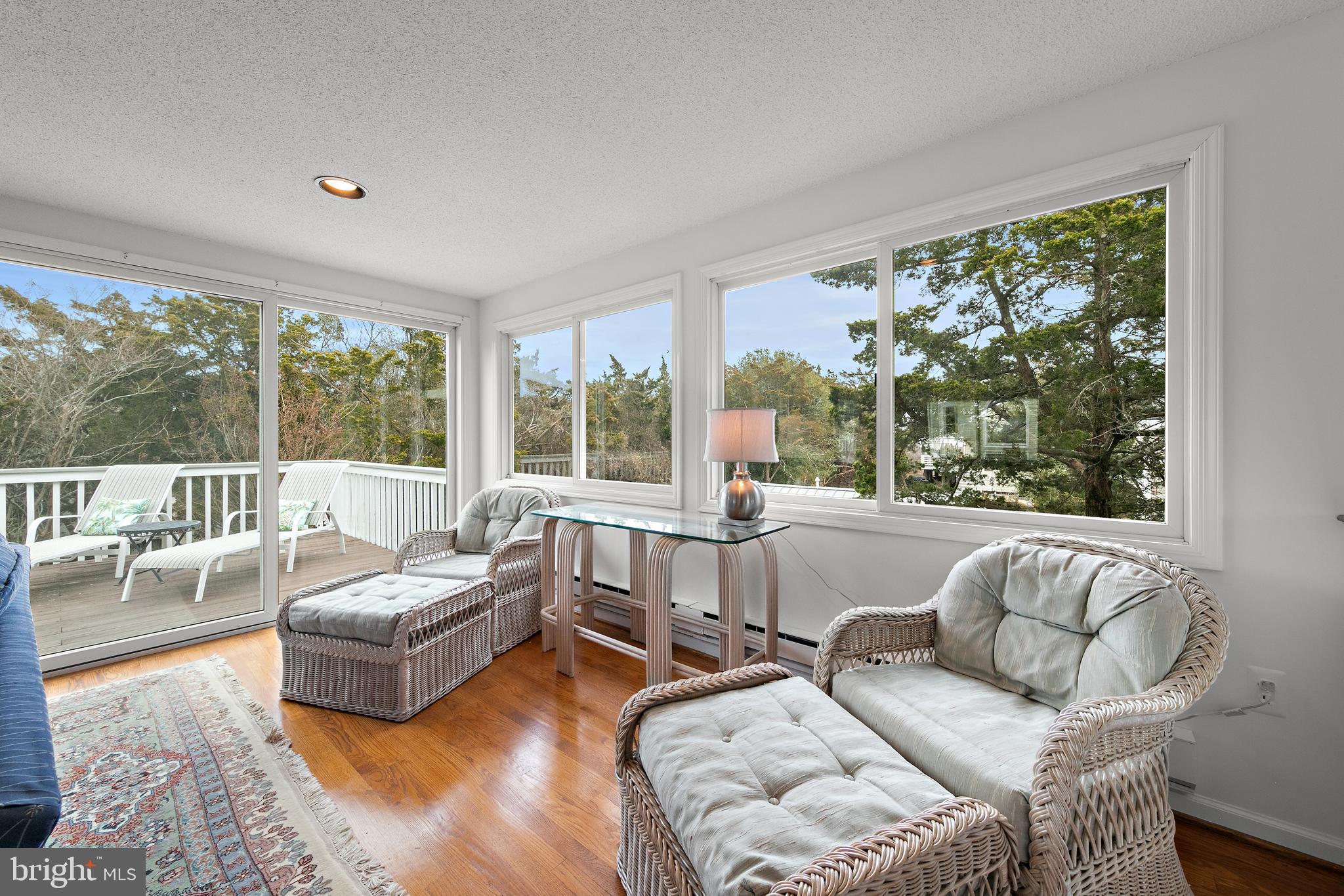20 East 8th Street Barnegat Light, NJ 08006 - Photo 11 of 80 a living room with furniture and a large window