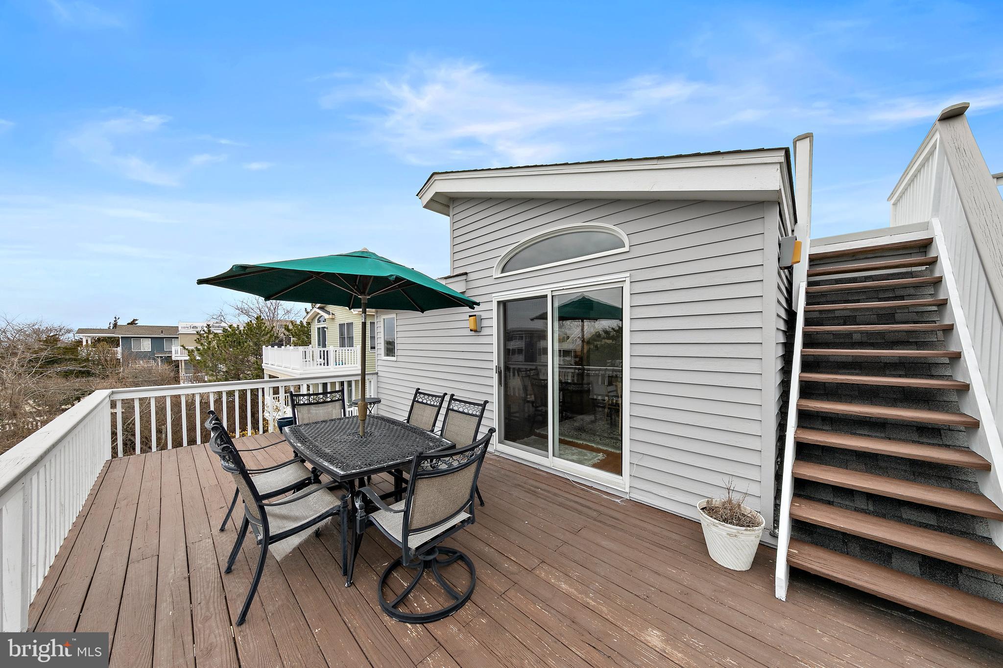 20 East 8th Street Barnegat Light, NJ 08006 - Photo 29 of 80 a view of a patio with a table and chairs