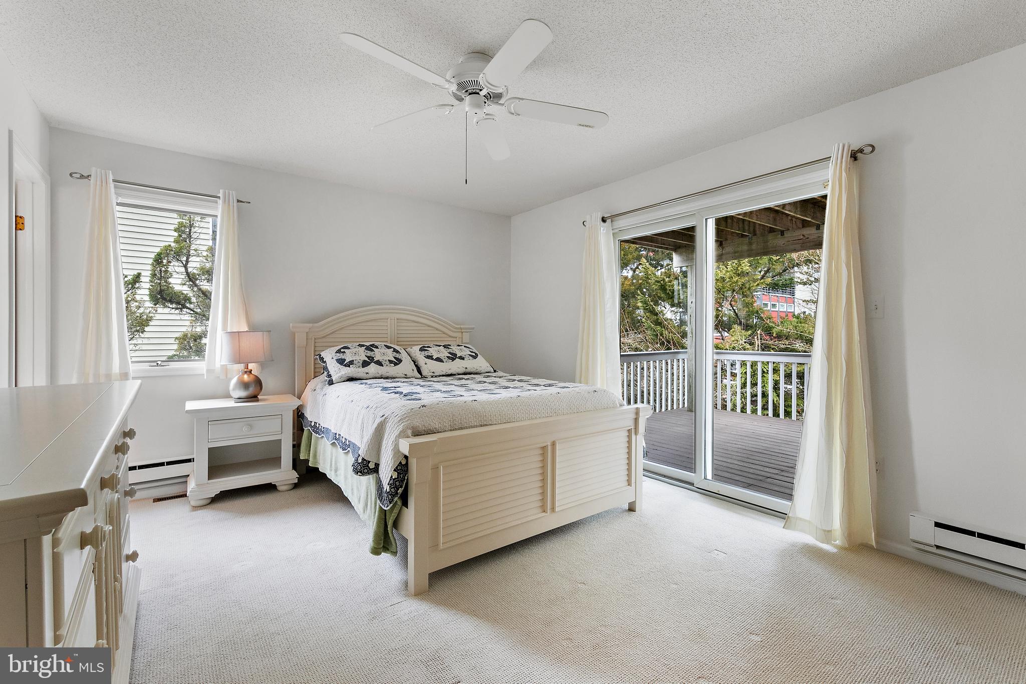 20 East 8th Street Barnegat Light, NJ 08006 - Photo 37 of 80 a bed sitting in a spacious bedroom next to a window