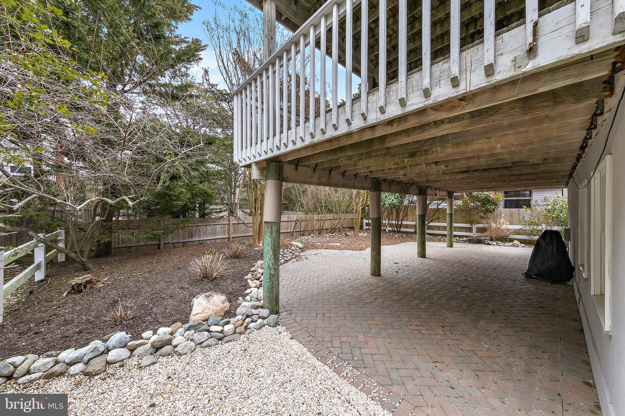 20 East 8th Street Barnegat Light, NJ 08006 - Photo 55 of 80 a view of a porch with furniture and a yard