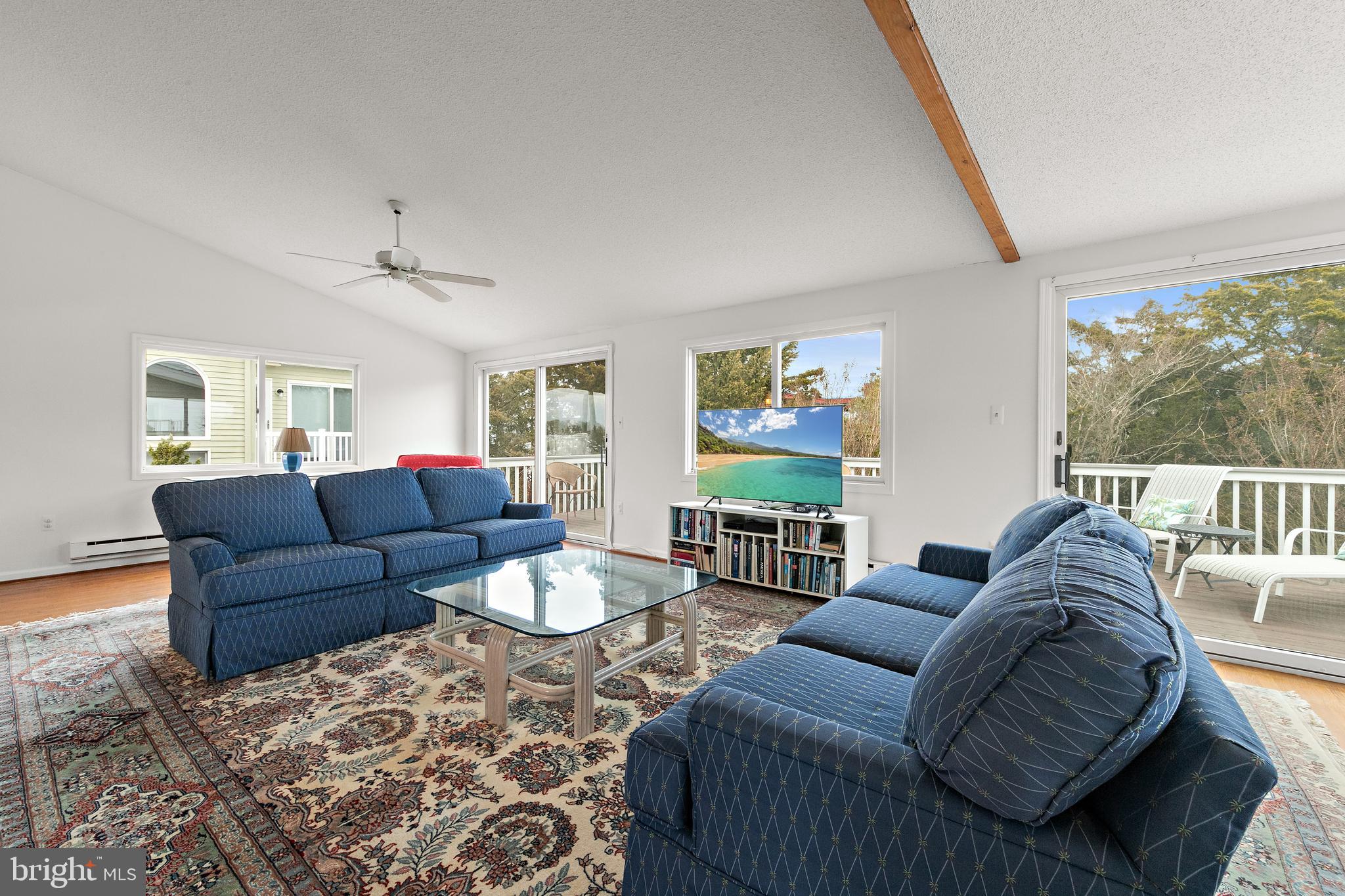 20 East 8th Street Barnegat Light, NJ 08006 - Photo 6 of 80 a living room with furniture and a large window