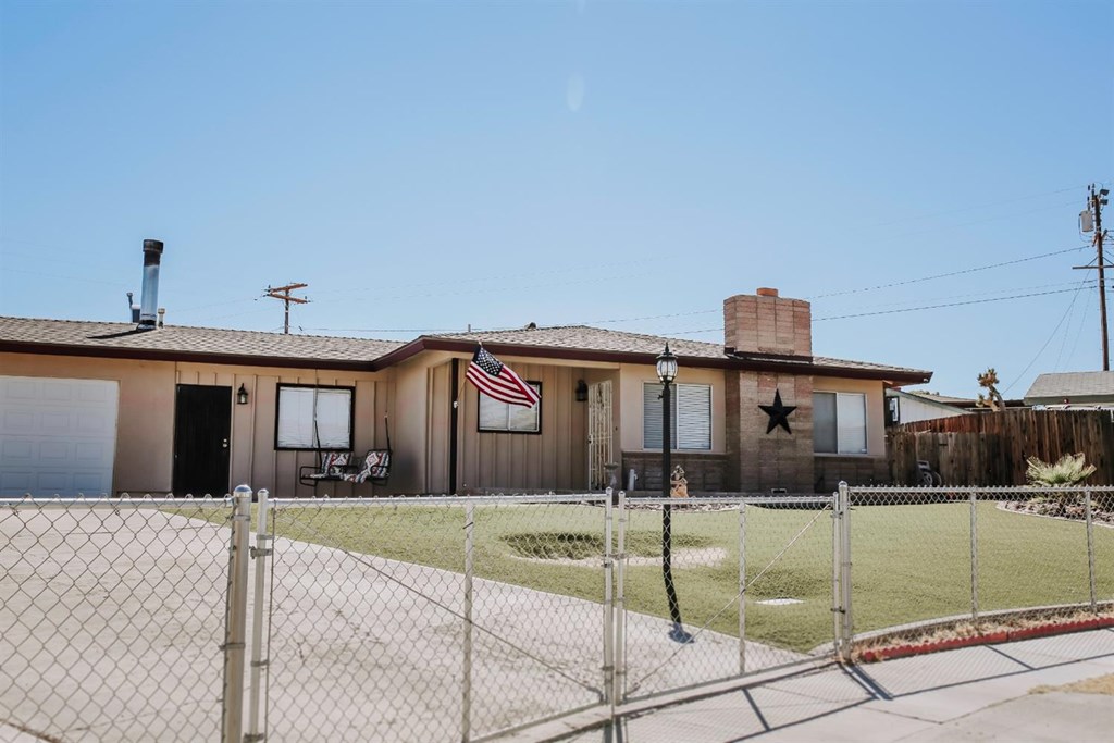 36976 Colby Avenue Barstow, CA 92311 - Photo 1 of 1 a front view of a house with a yard