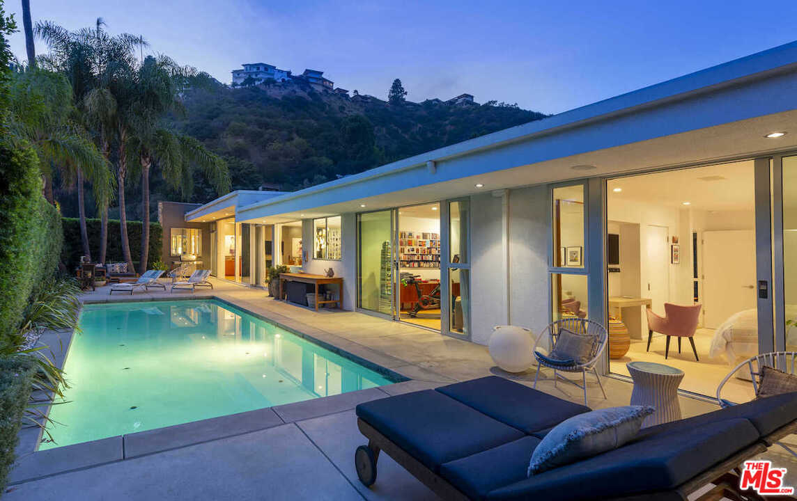 1566 Rising Glen Road Los Angeles, CA 90069 - Photo 1 of 32 a view of swimming pool with seating area