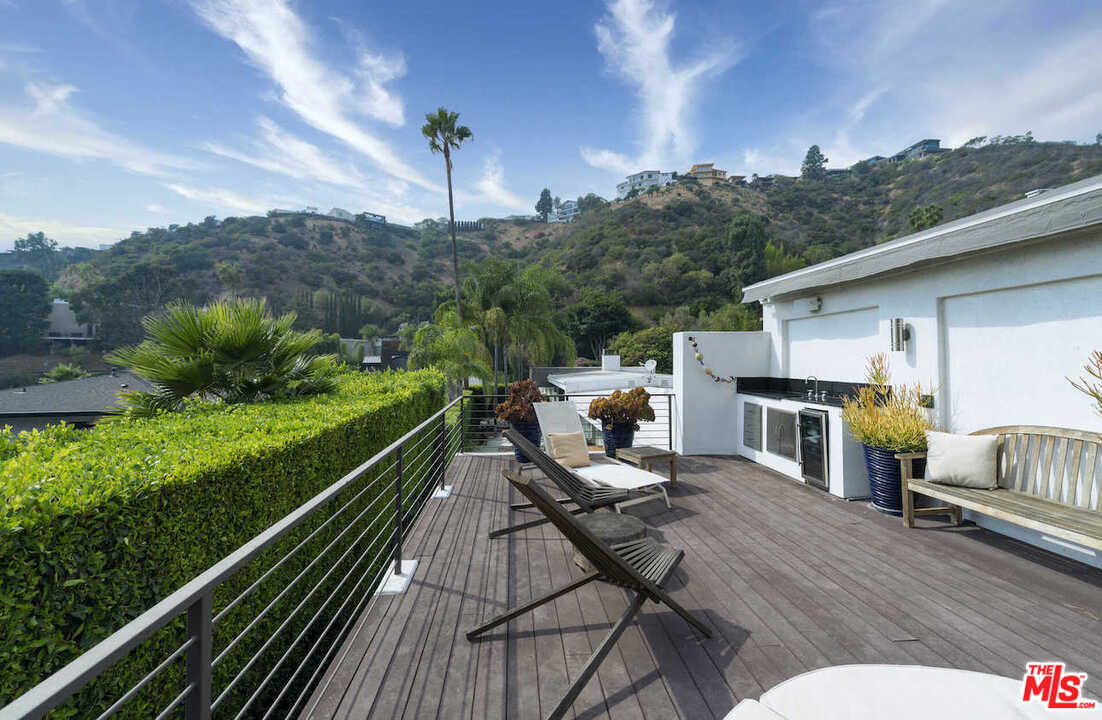 1566 Rising Glen Road Los Angeles, CA 90069 - Photo 26 of 32 a view of a roof deck with couches