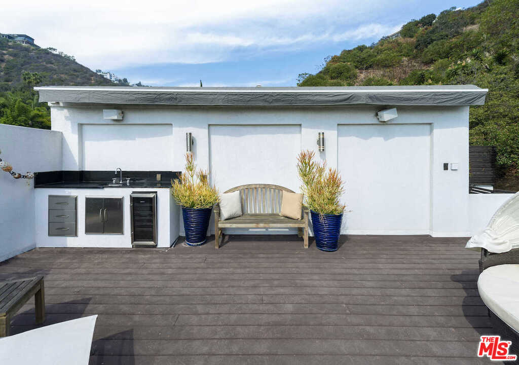 1566 Rising Glen Road Los Angeles, CA 90069 - Photo 27 of 32 a front view of a house with yard