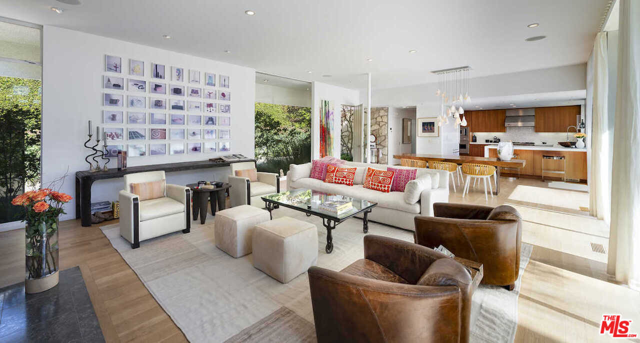 1566 Rising Glen Road Los Angeles, CA 90069 - Photo 7 of 32 a living room with furniture and a large window