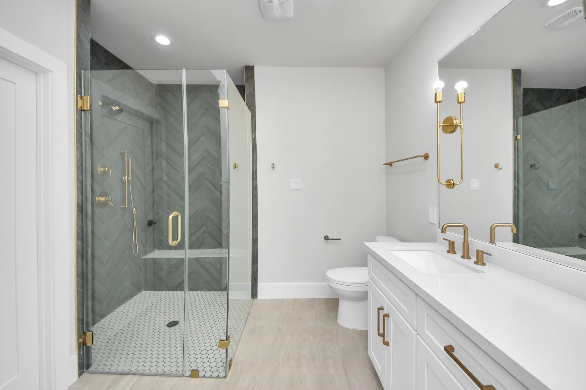 6320 Milwee Street, Unit B Houston, TX 77092 - Photo 21 of 30 a bathroom with a sink toilet and shower