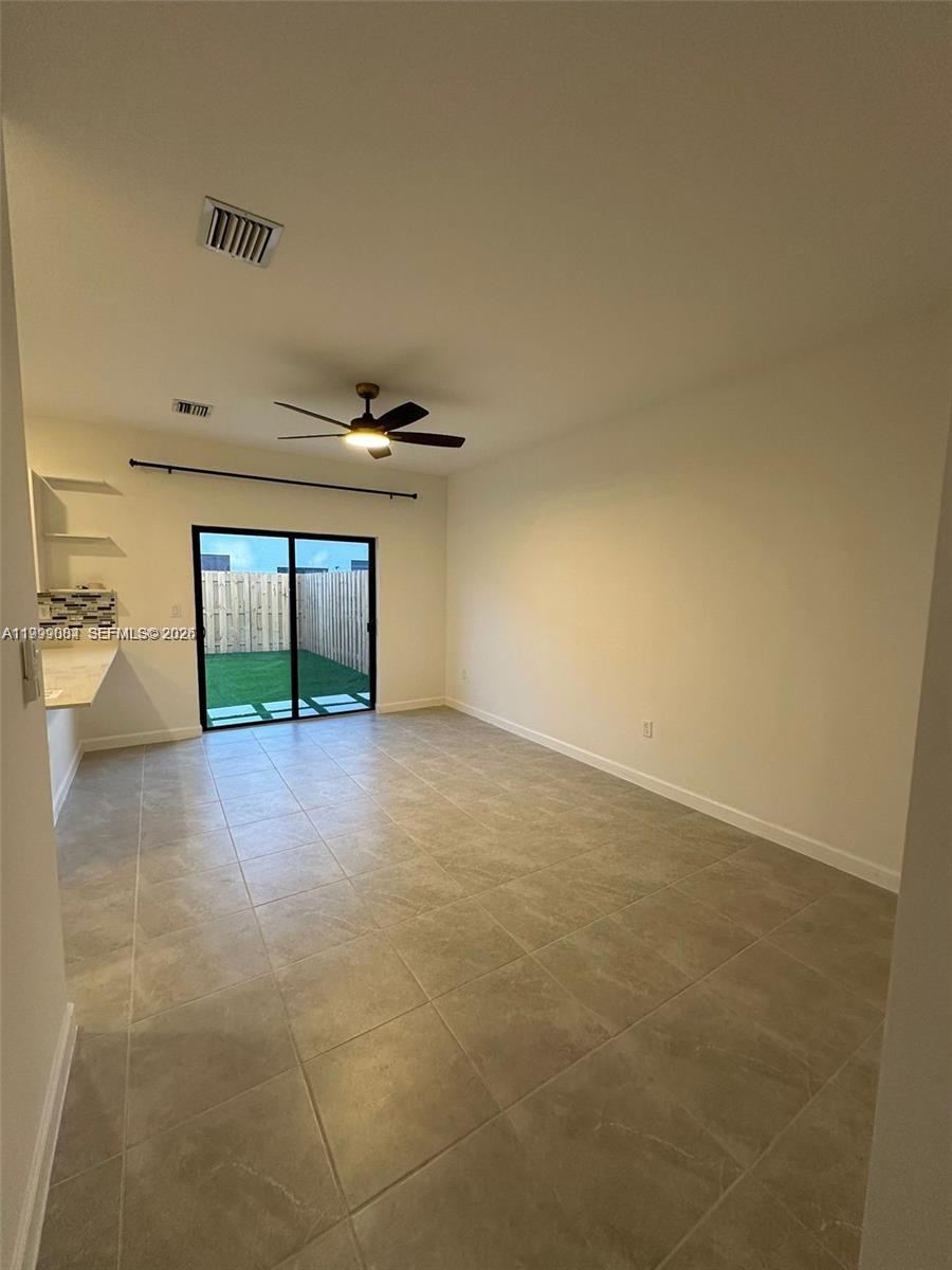 12868 Southwest 232nd Terrace Homestead, FL 33032 - Photo 12 of 48 a view of a livingroom with an empty space and a fireplace