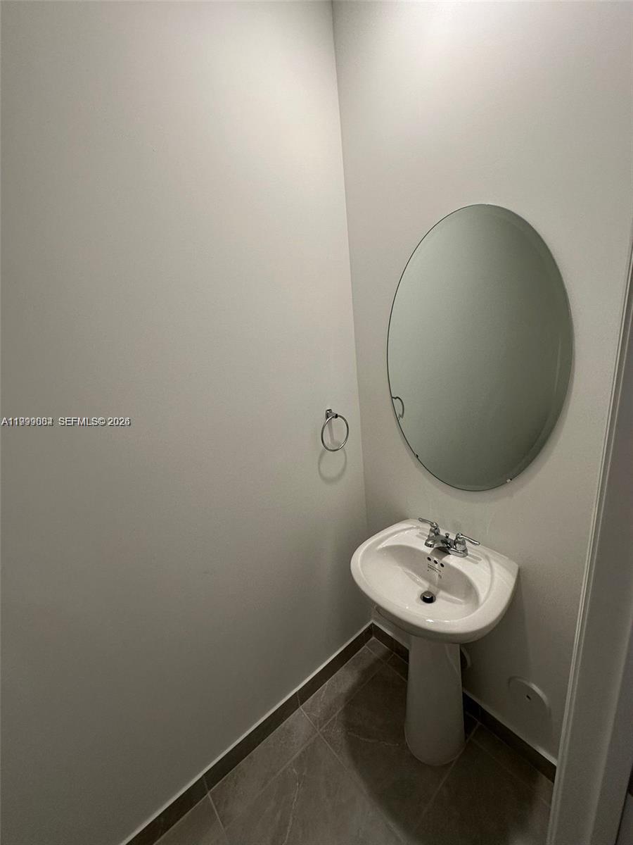 12868 Southwest 232nd Terrace Homestead, FL 33032 - Photo 19 of 48 a sink with a mirror