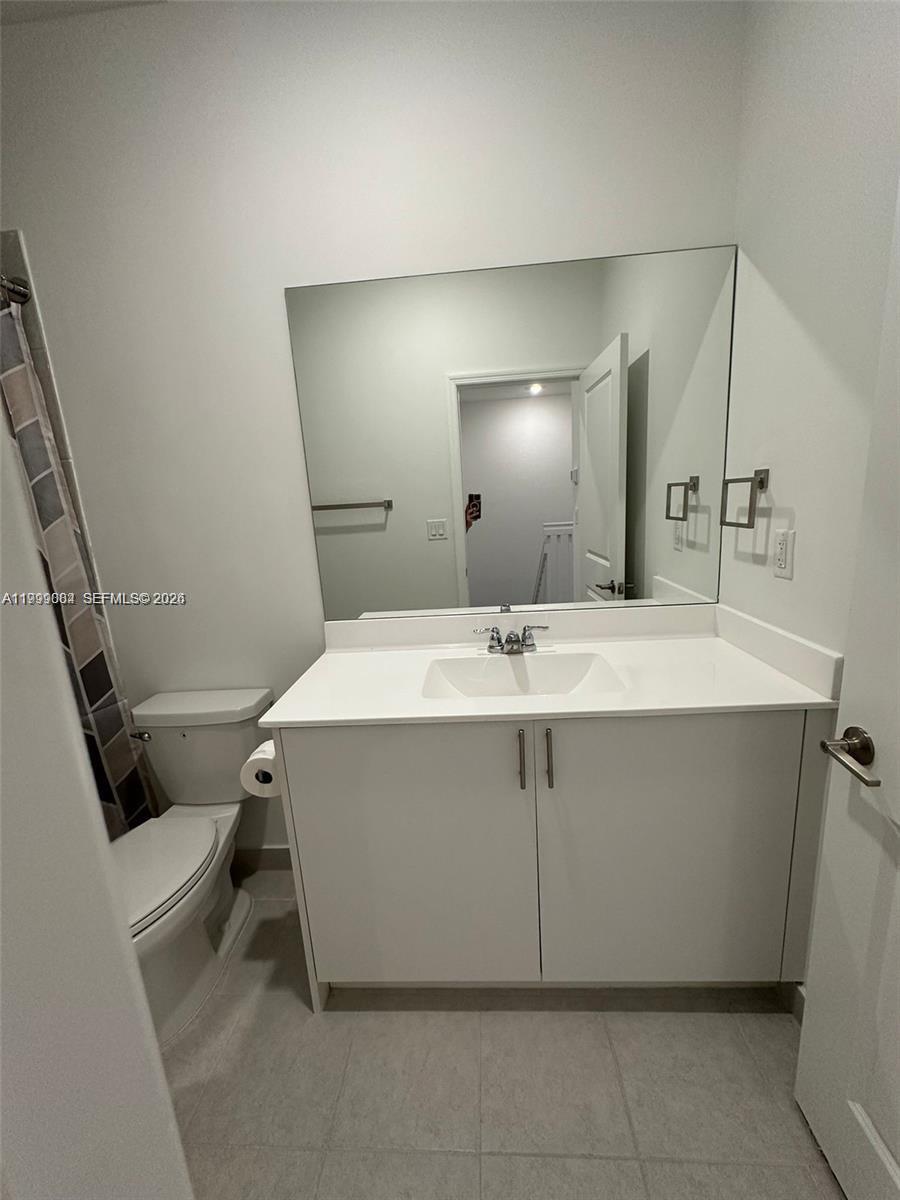 12868 Southwest 232nd Terrace Homestead, FL 33032 - Photo 23 of 48 a bathroom with a sink and a mirror
