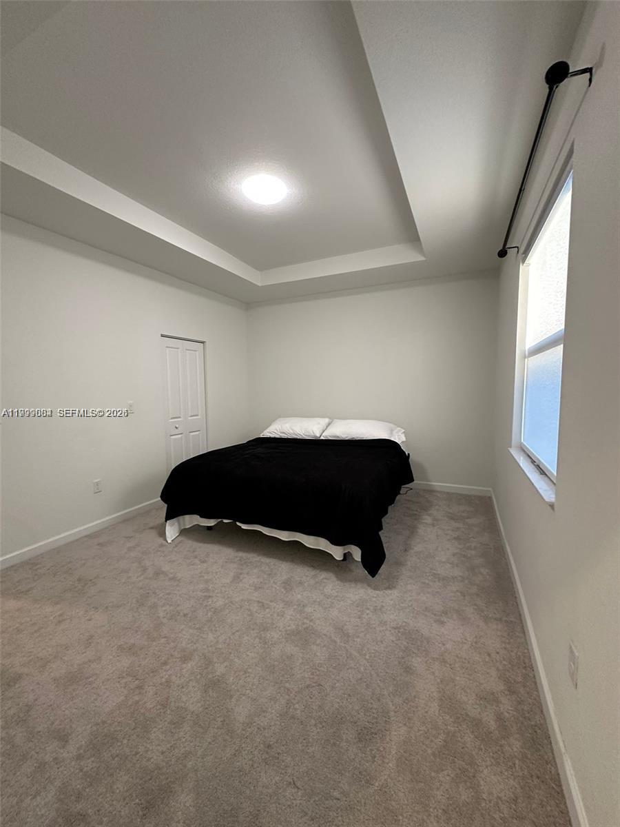 12868 Southwest 232nd Terrace Homestead, FL 33032 - Photo 25 of 48 a room with a bed and a window