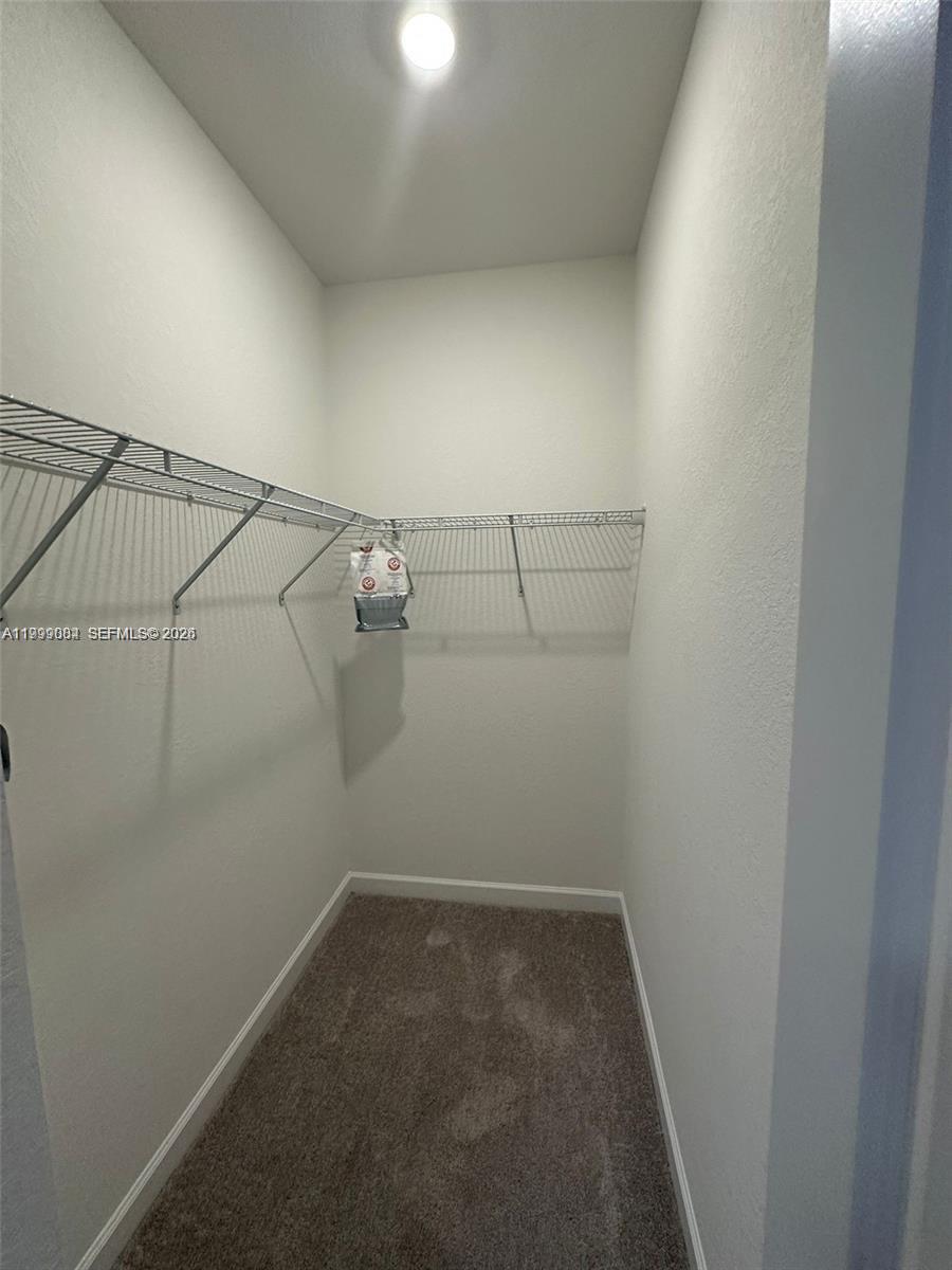 12868 Southwest 232nd Terrace Homestead, FL 33032 - Photo 31 of 48 a view of a room with racks on the wall