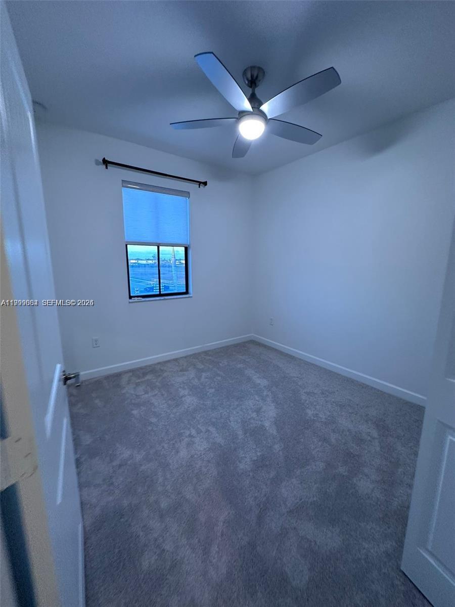 12868 Southwest 232nd Terrace Homestead, FL 33032 - Photo 37 of 48 an empty room with a window