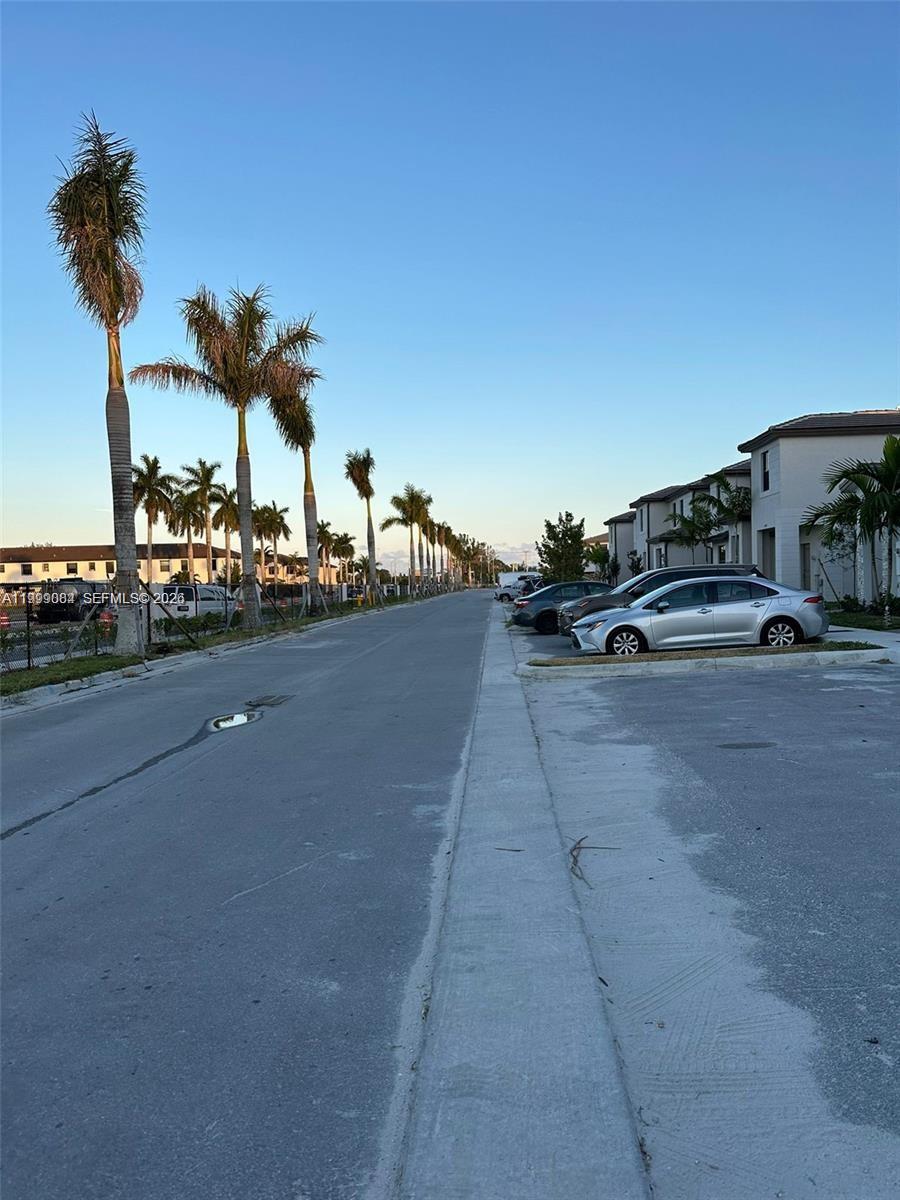 12868 Southwest 232nd Terrace Homestead, FL 33032 - Photo 44 of 48 a view of a street with cars