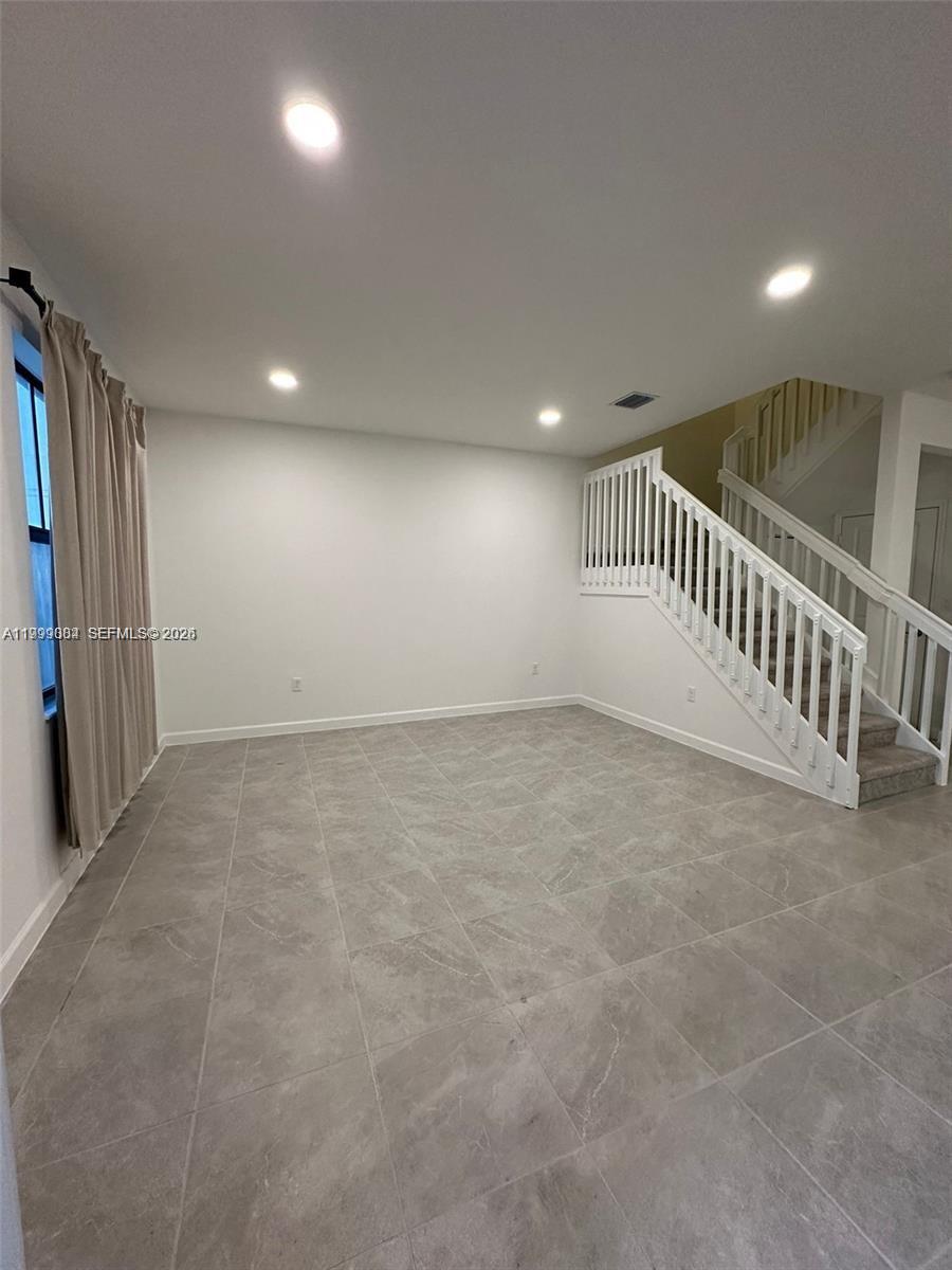 12868 Southwest 232nd Terrace Homestead, FL 33032 - Photo 6 of 48 an empty room with windows