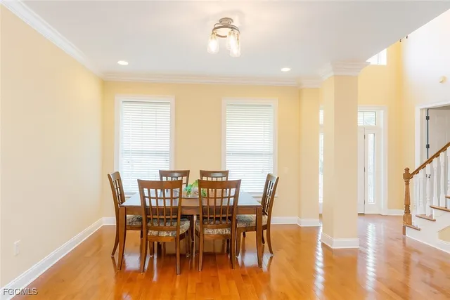 a view of a dining room with furniture and wooden floor