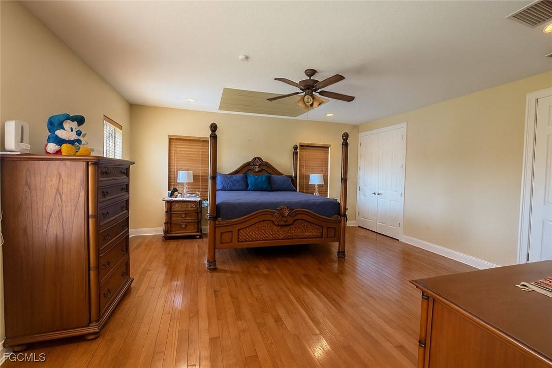 965 Stenstrom Road Wauchula, FL 33873 - Photo 14 of 25 a bedroom with furniture and wooden floor